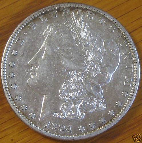 1884 S MORGAN DOLLAR AU   